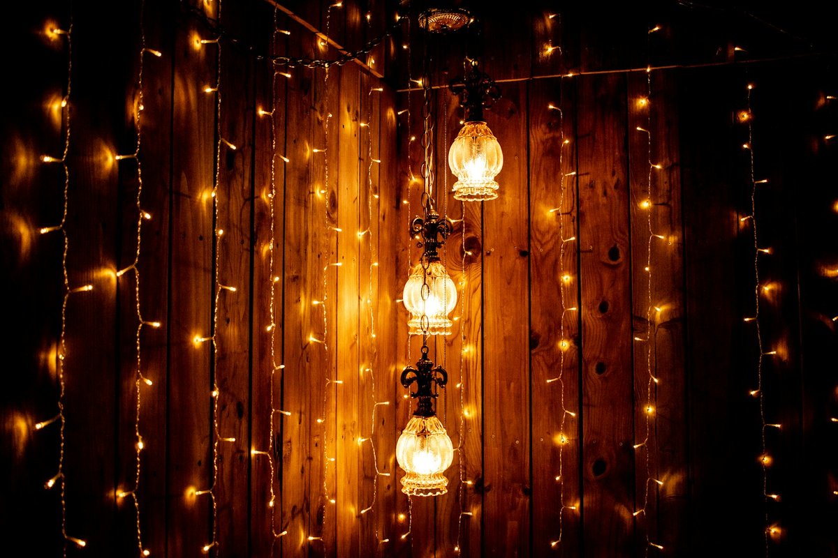 Curtain lights hanging vertically from a wall